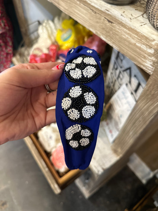 Blue beaded soccer headband.