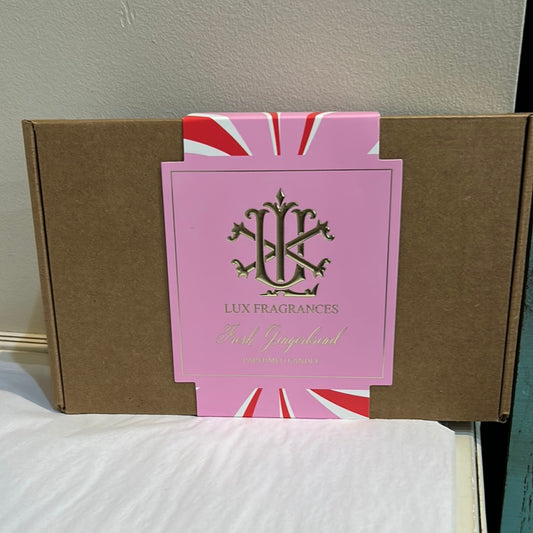 Brown box with pink packaging featuring "Lux Fragrances; Fresh Gingerbread".