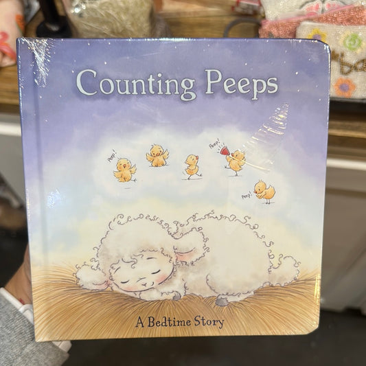 Small book with a lamb asleep, counting chicks.