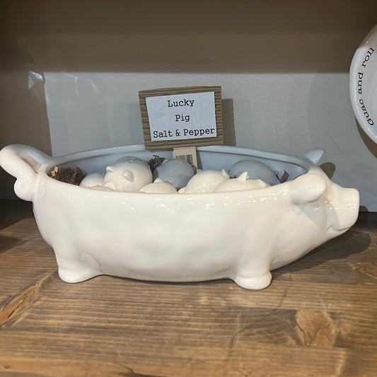 White glazed ceramic salt and pepper shakers shaped like a pig.