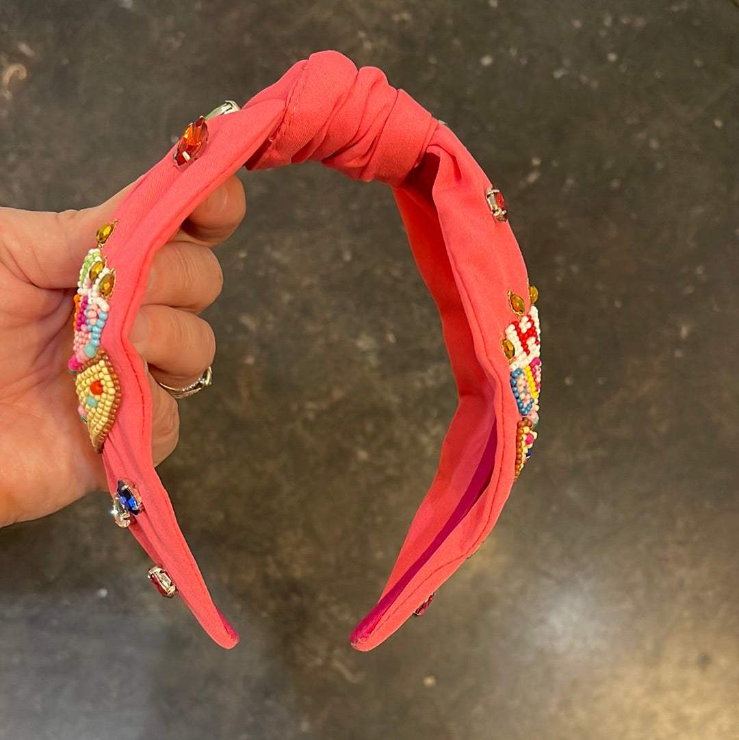 Pink topknot beaded birthday headband with colorful beading and jewels all around.