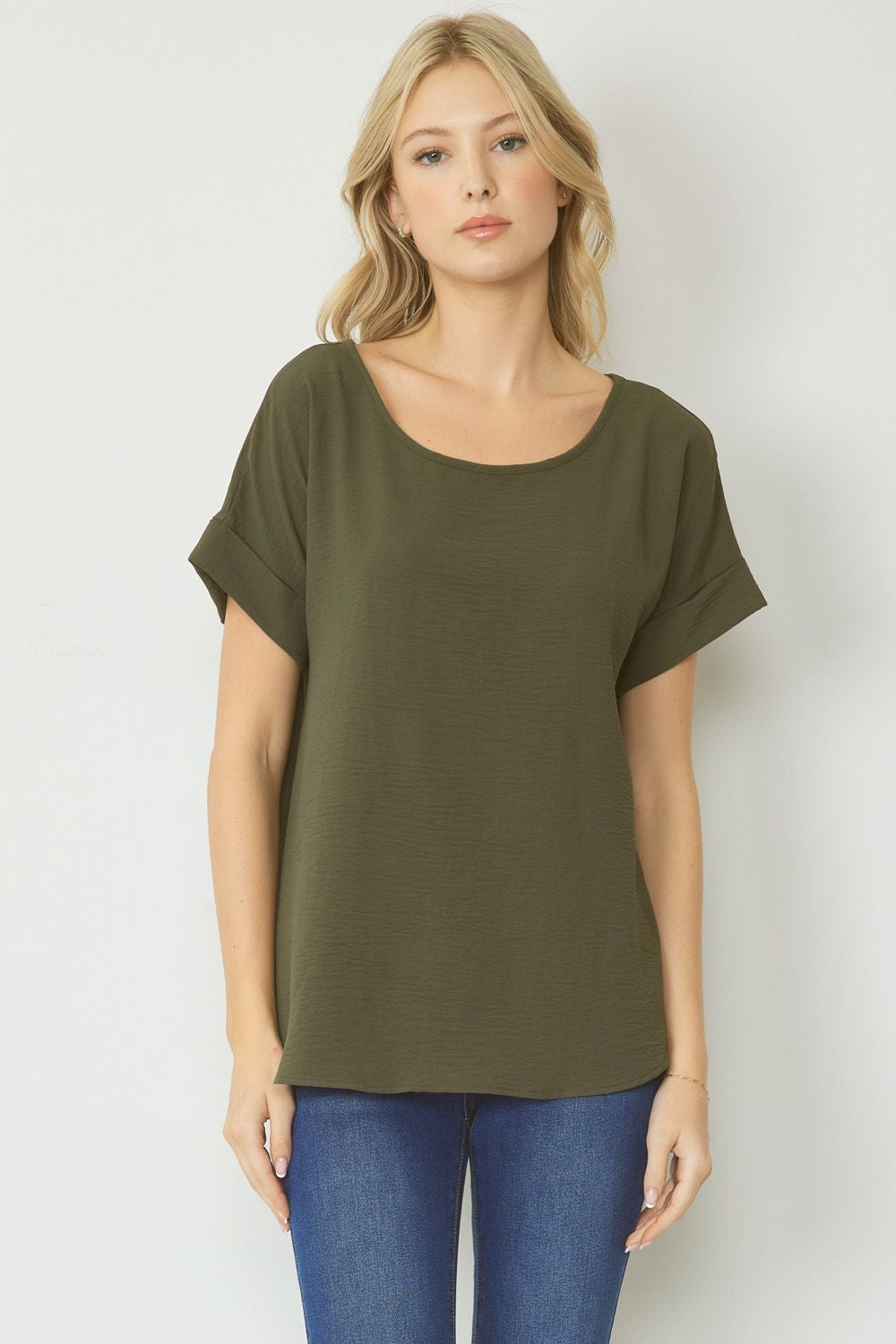 Olive scoop-neck top featuring permanent rolled sleeve detail and an asymmetrical hem.