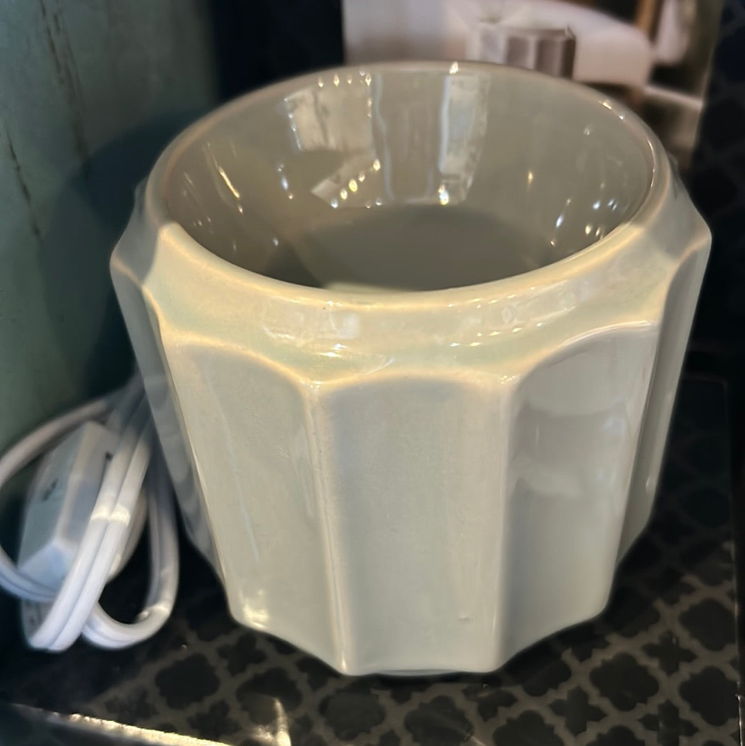 Light gray wax bar electric warmer.