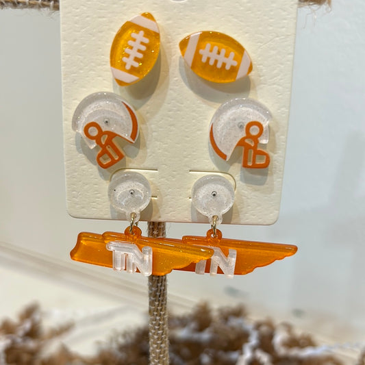 Assorted University of Tennessee acrylic earrings featuring: football; helmet; Tennessee.