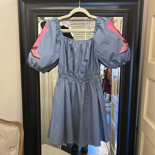 Denim blue poplin dress with a square neckline and pink cowgirl boots.
