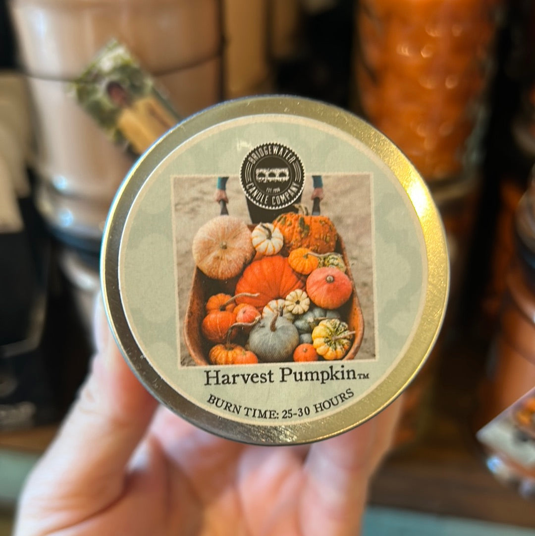 Candle lid featuring pumpkins and "Harvest Pumpkin".