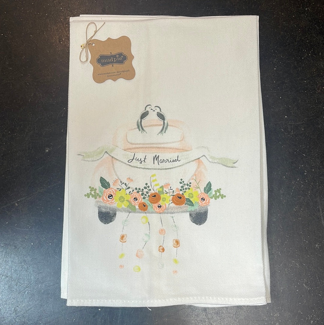 "Just married" newlywed decorative dish towel featuring a car with flowers on it and stringed cans.