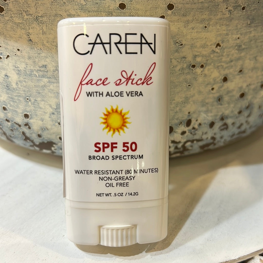 Caren face stick with aloe vera and SPF 50. Water resisitant. non-greasy. Oil free. White packaging with red and black lettering with a sun.
