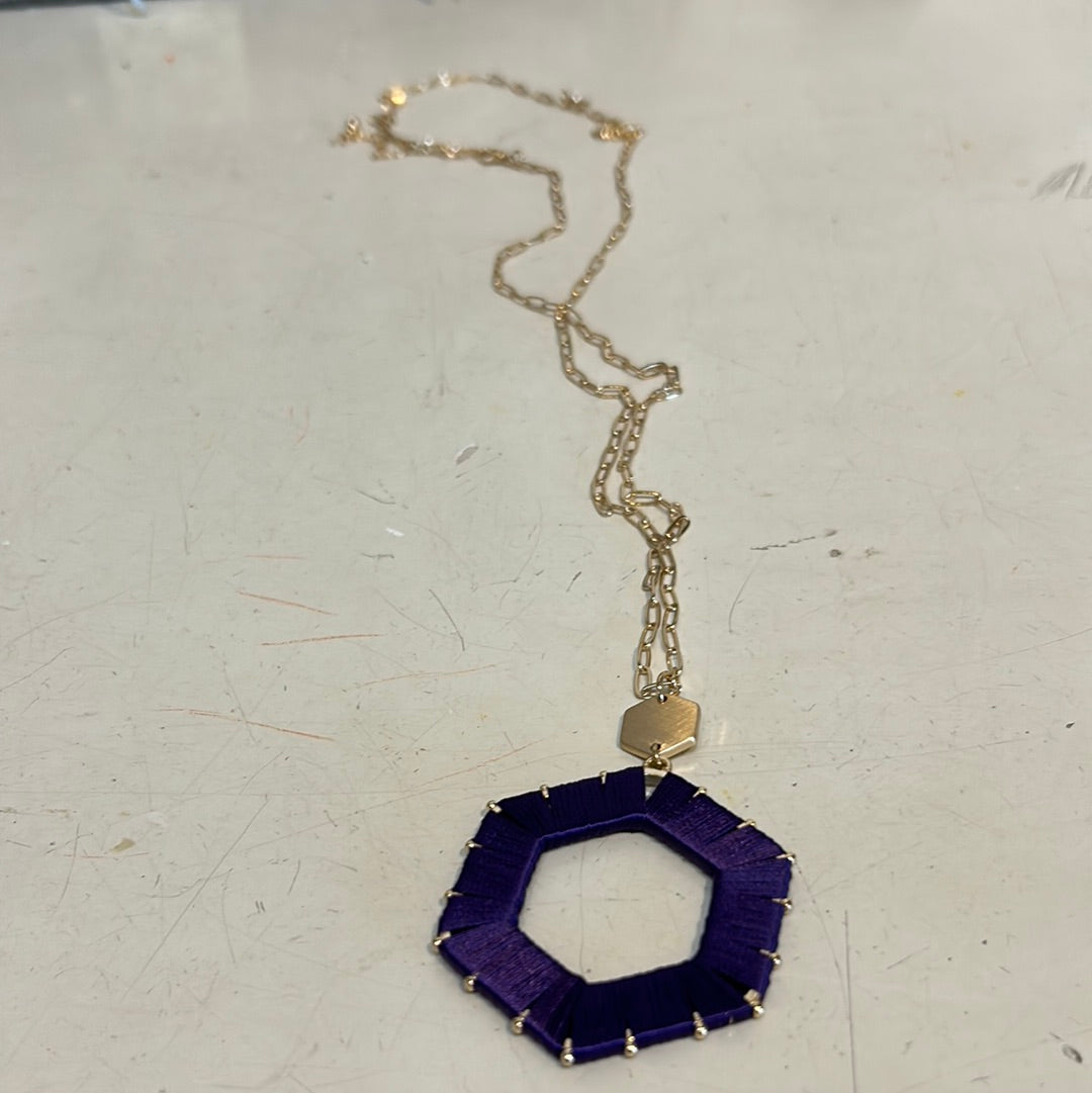 Purple threaded hexagon game day necklace.