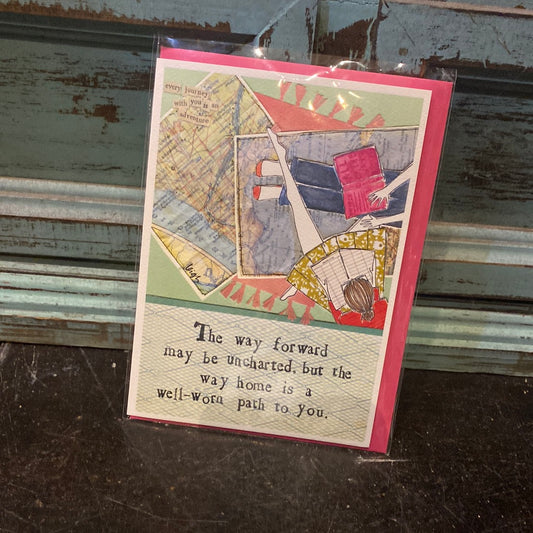 Card with an aerial view of a girl in jeans with maps displaying “The way forward may be uncharted, but the way home is a well-worn path to you.” 