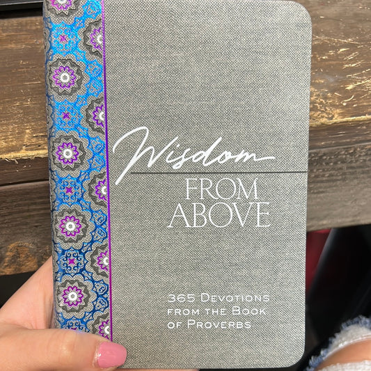 Gray book with geometric patterned binder titling "Wisdom From Above".