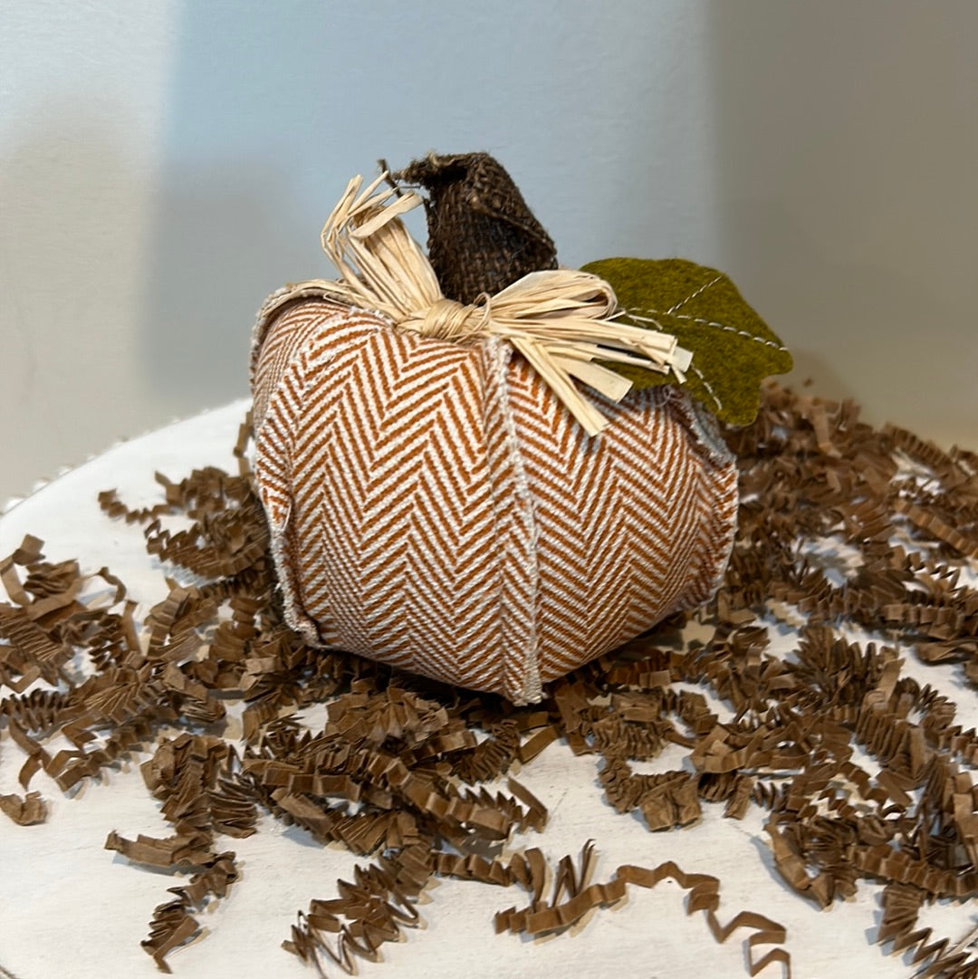 Orange chevron patterned small pumpkin.
