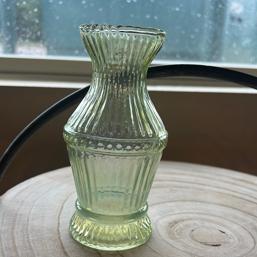 Small green transparent vase.
