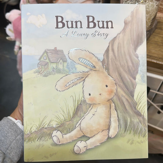A small book with a bunny leaned on a tree and a cabin in the background on the cover with "Bun Bun" in brown lettering.