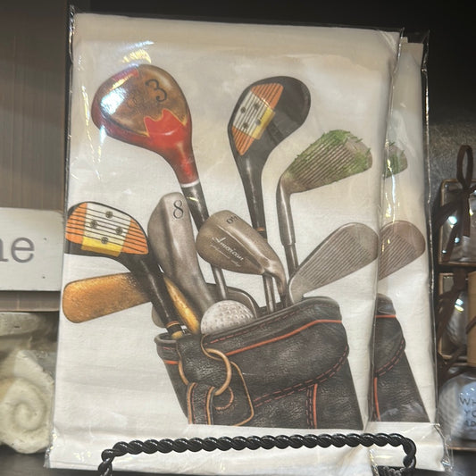 White towel featuring assorted golf clubs.