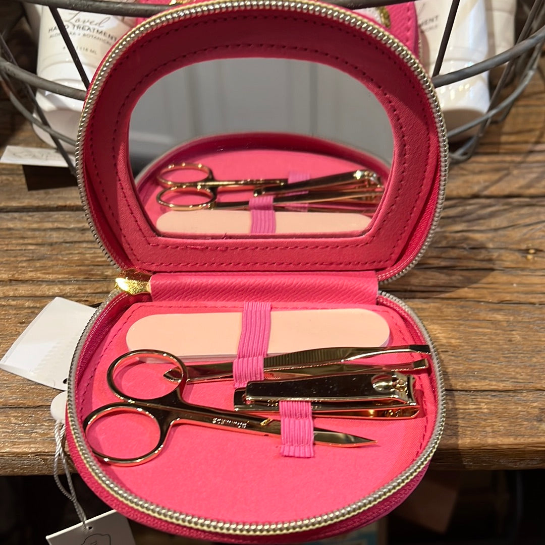 Hot pink manicure set with golden tools.