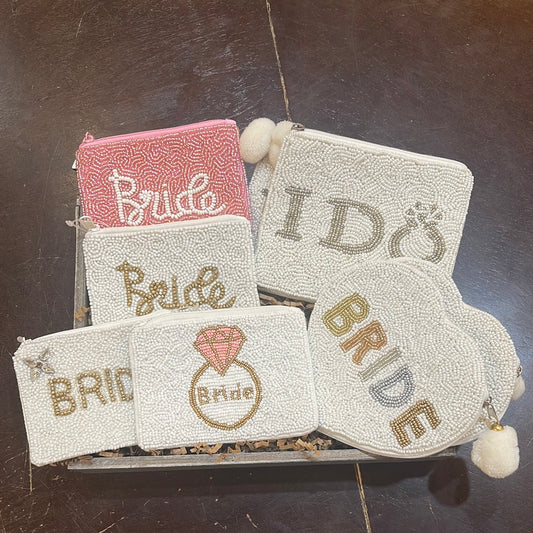 Assorted hand sewn bridal coin purses.