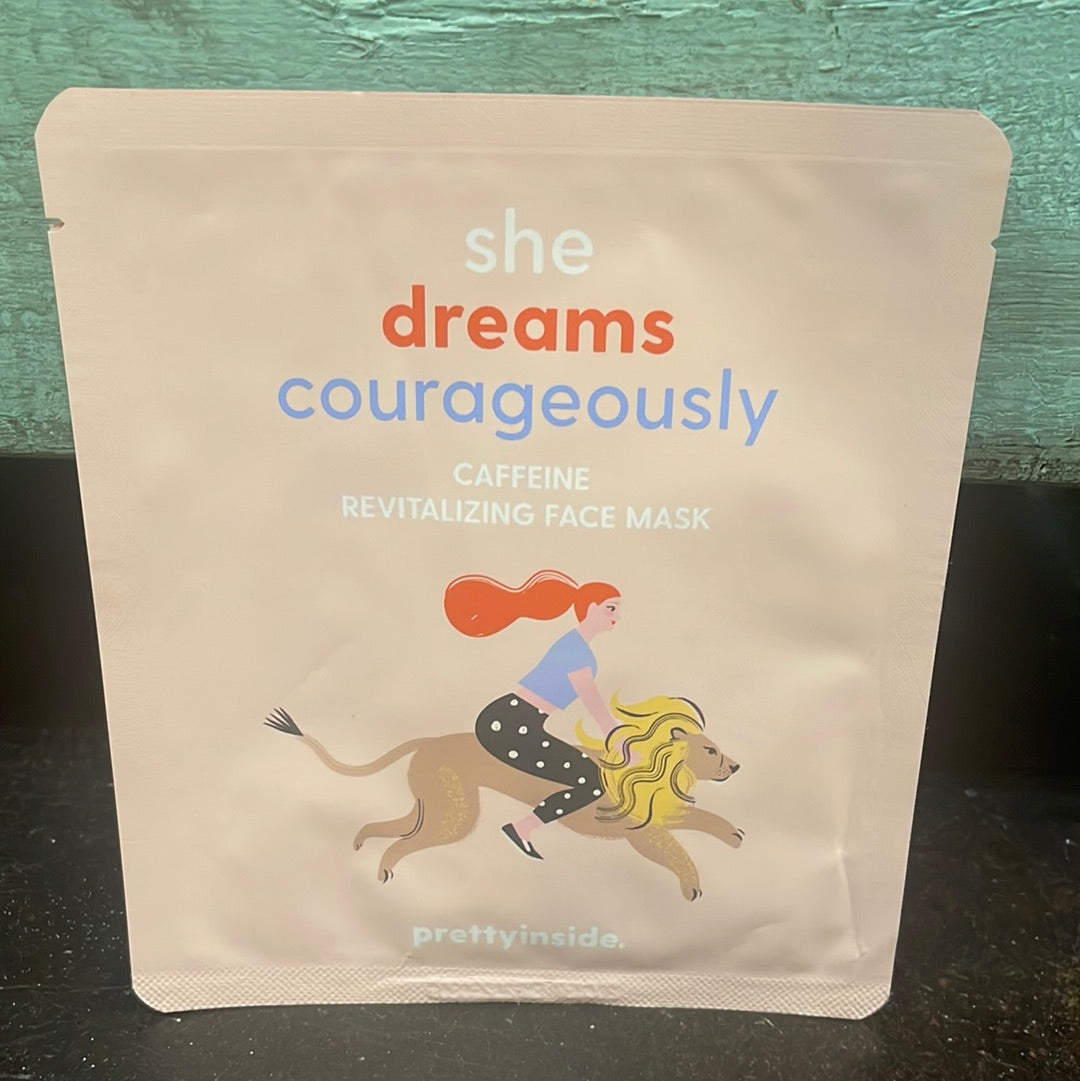 "She dreams courageously" caffeine revitalizing face mask in light pink packaging.