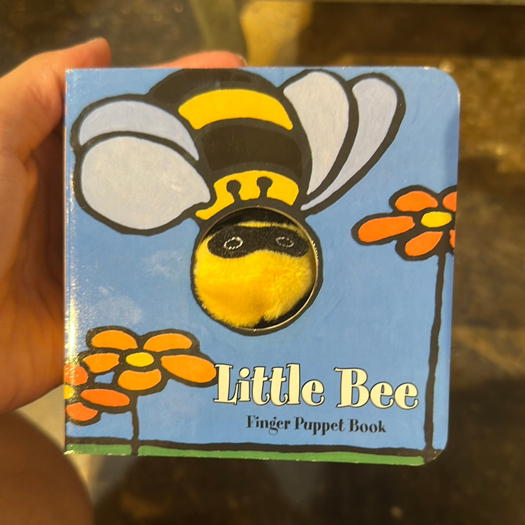 "Little Bee" finger puppet book with a bee with flowers.