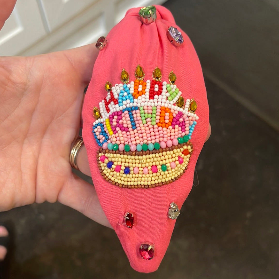 Pink topknot beaded birthday headband with colorful beading and jewels all around.