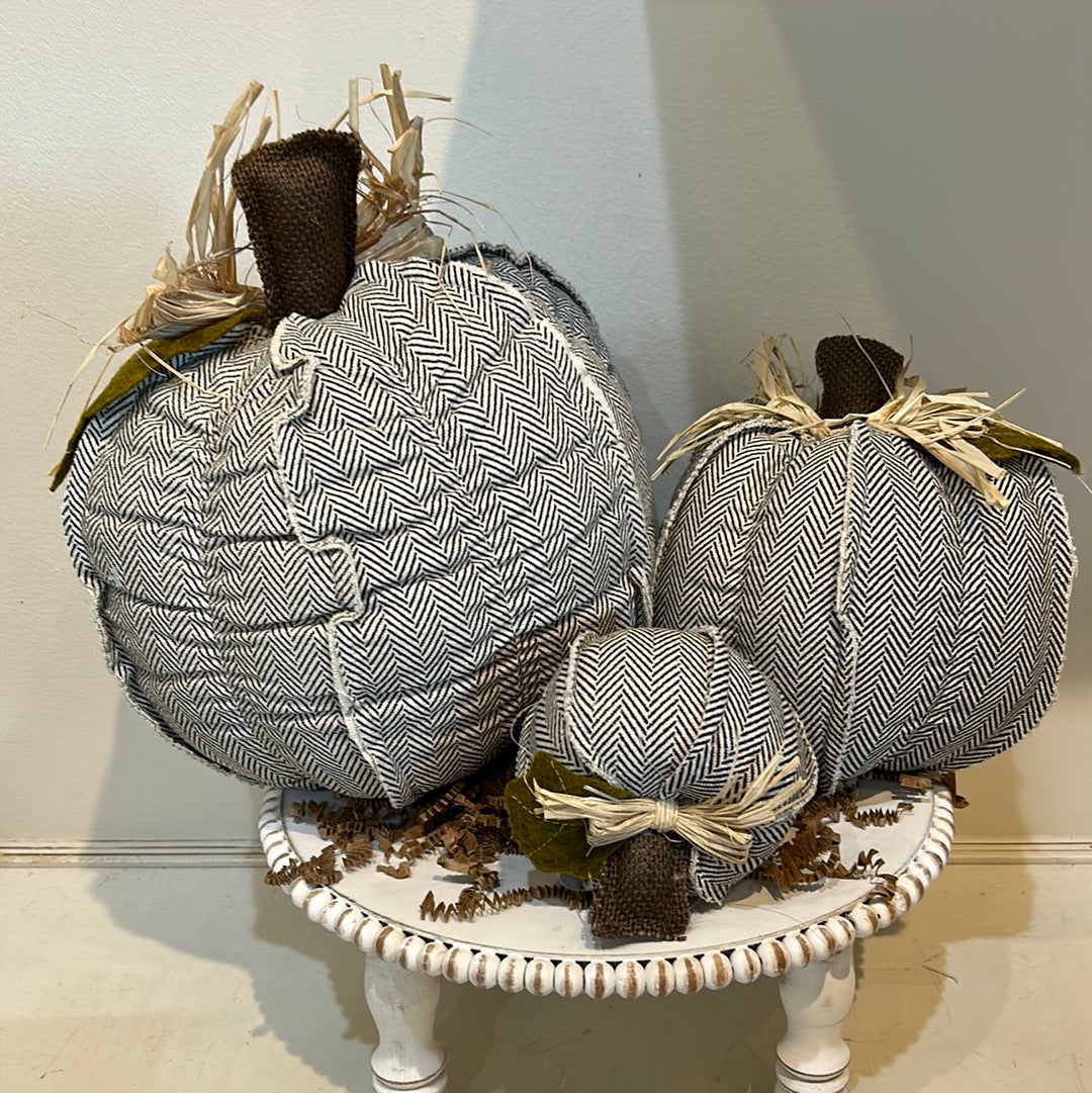 Black chevron patterned pumpkins in three varying sizes.