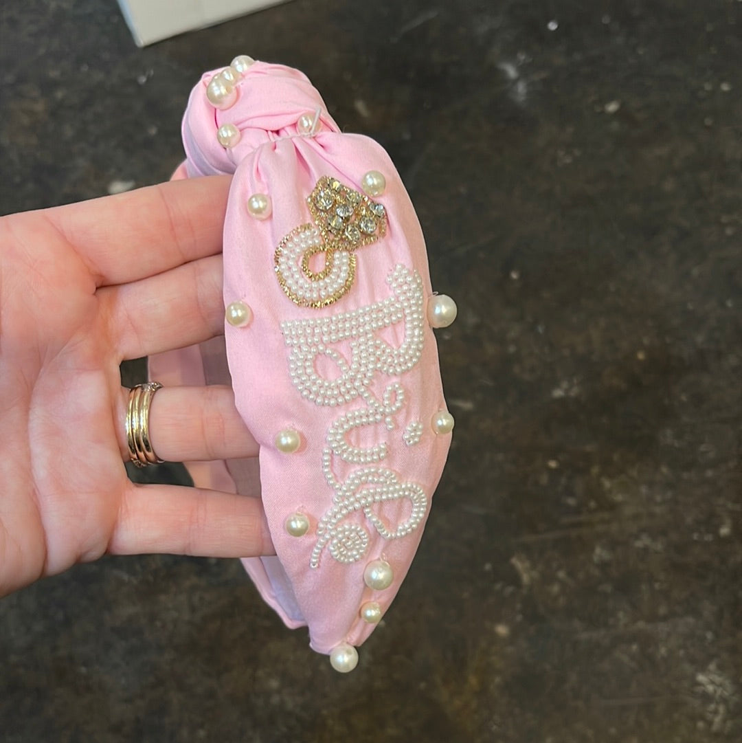 Pink topknot headband with "Bride" and a diamond ring in white beading with pearls.