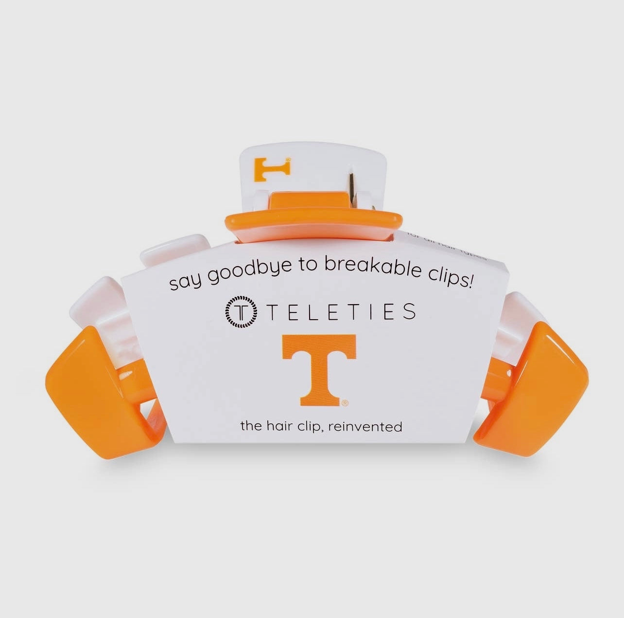 University of Tennessee Collegiate Teletie Claw Clip in orange and white. Side view with packaging.