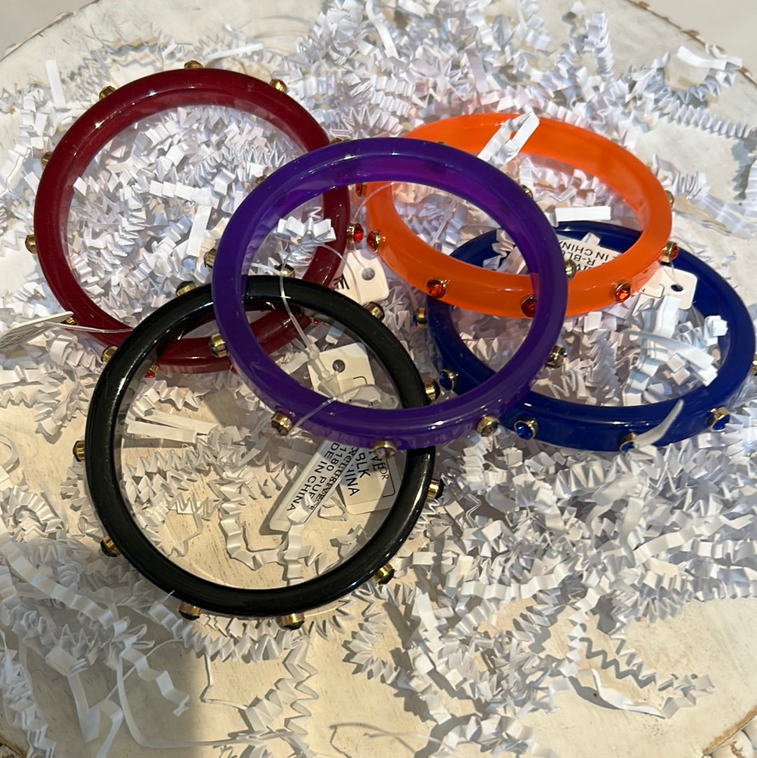 Acrylic Bangle with Stone Accents featuring varying colors.