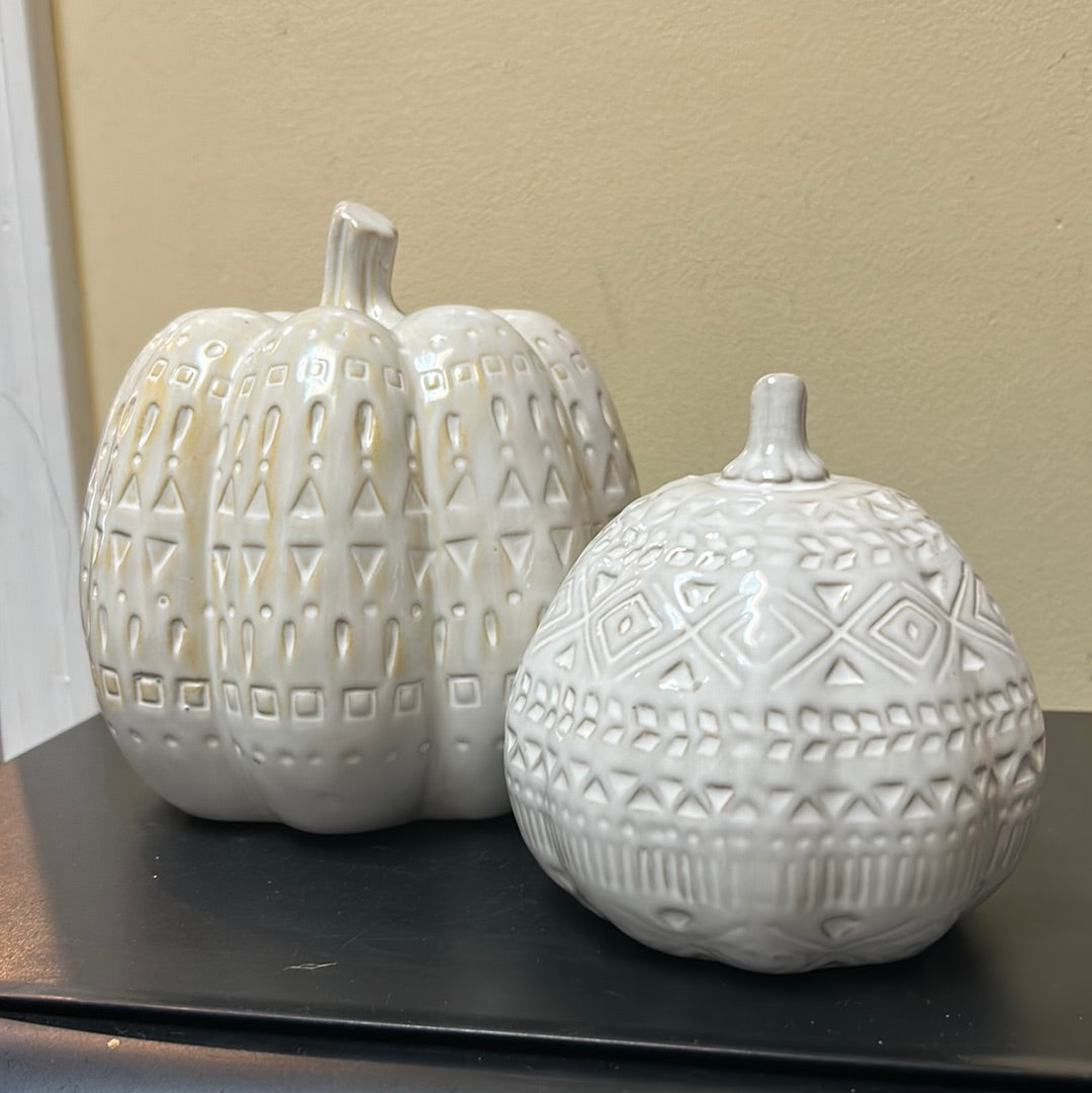 Set of 2 white ceramic decorative pumpkins with boho pattern.