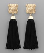 Black tassel earrings with a golden bulldog.