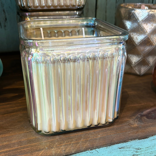 Candle in a Square-shaped Iridescent Clear Glass Vessel.