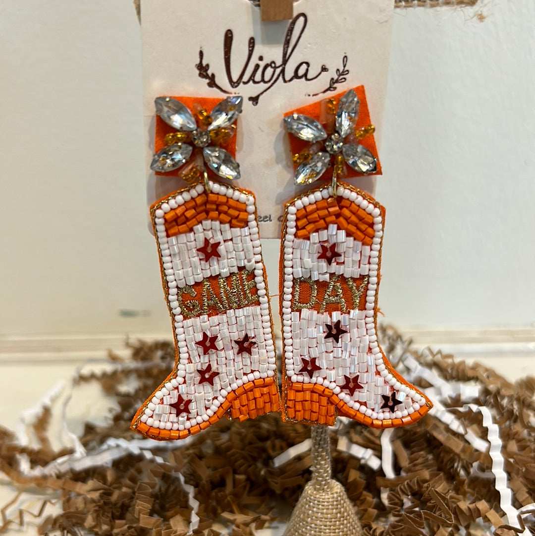 Orange and white beaded boot dangling earrings displaying "Game Day".