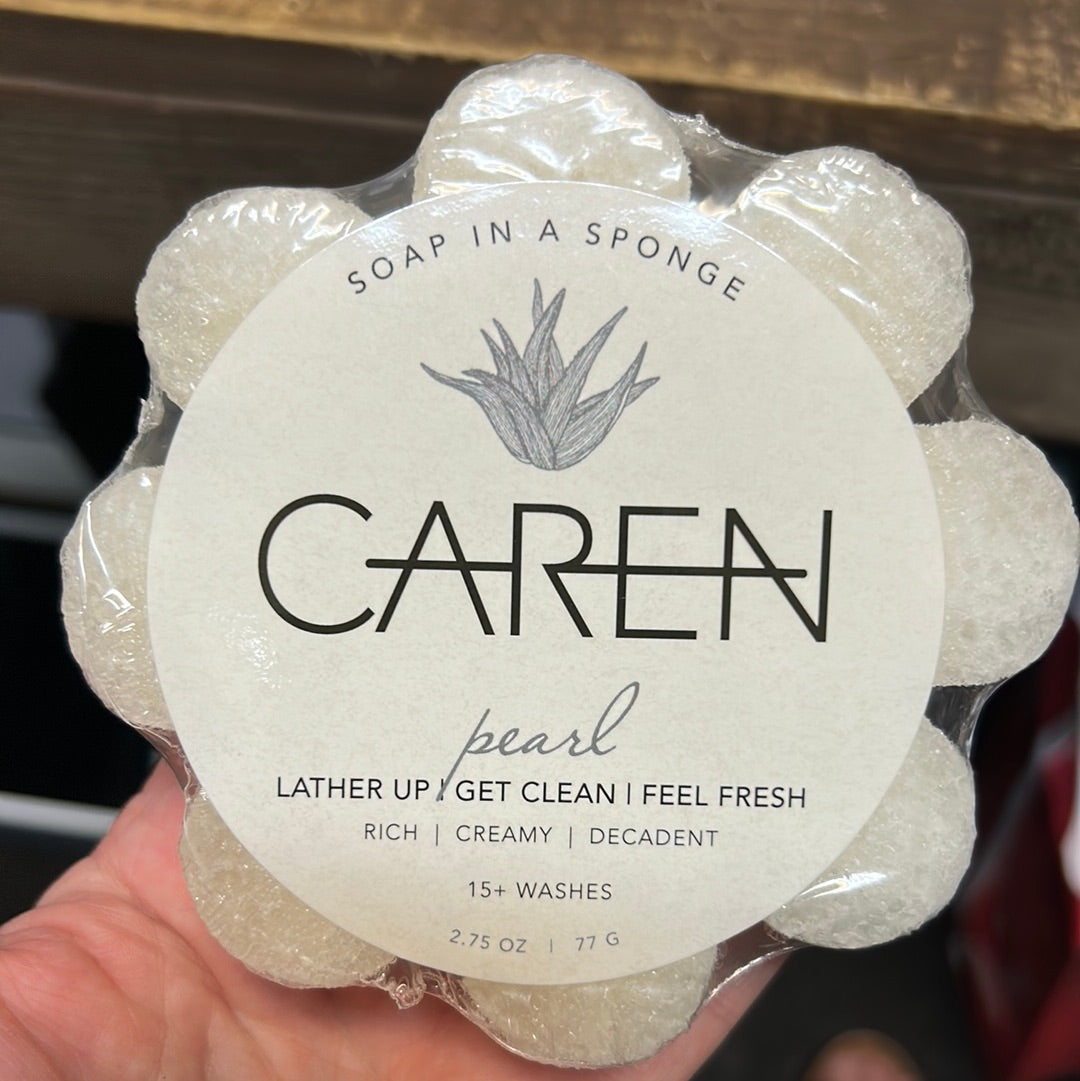 Caren "Pearl" soap sponge shaped like a white flower.