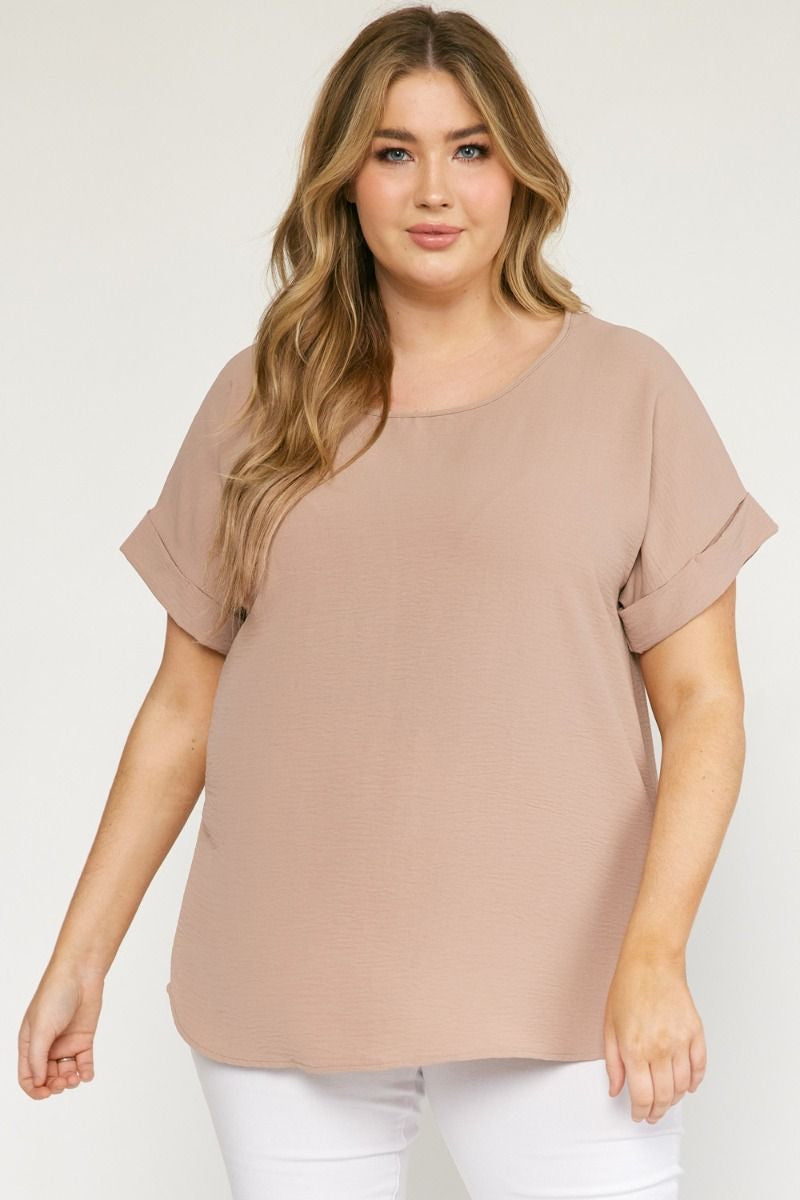 Latte scoop-neck top featuring permanent rolled sleeve detail and an asymmetrical hem.