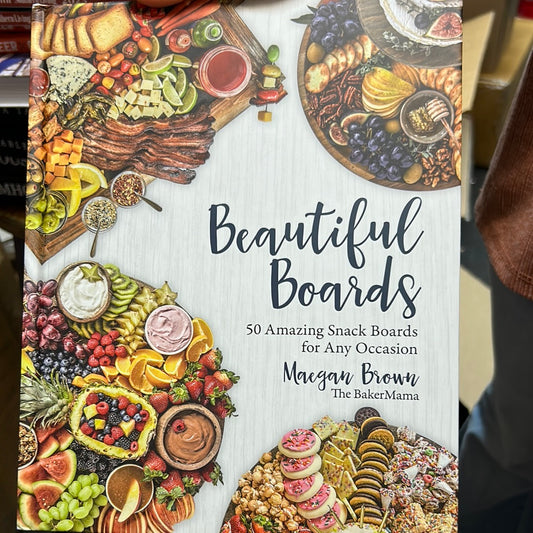 Book featuring varying charcuterie boards on a white background with "Beautiful Boards" in black lettering.