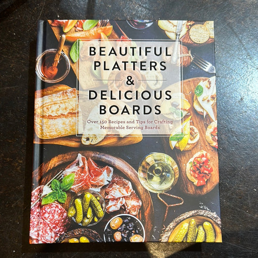 Cover is a depiction of charcuterie boards with "Beautiful Platters & Delicious Boards" in black lettering.