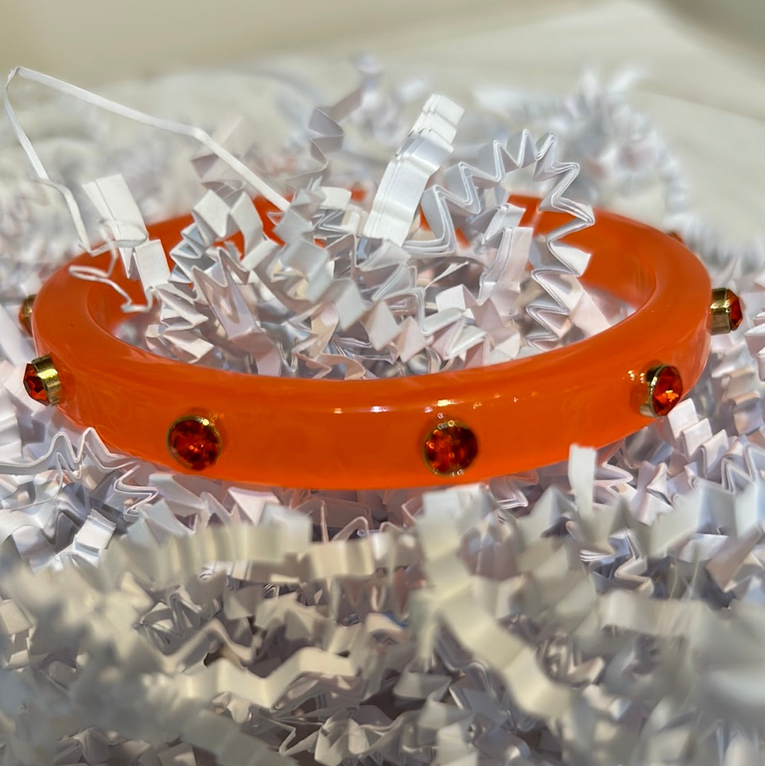 Orange Acrylic Bangle with Stone Accents.