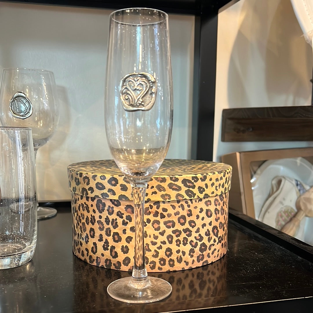 Hand blown drinking glass with custom pewter hearts stamp.
