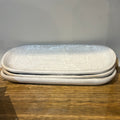 10-inch rustic, off-white ceramic tray with rounded edges.