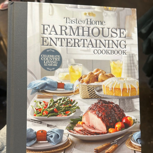 Cookbook with a feast on the cover displaying "Taste of Home: Farmhouse Entertaining Cookbook".