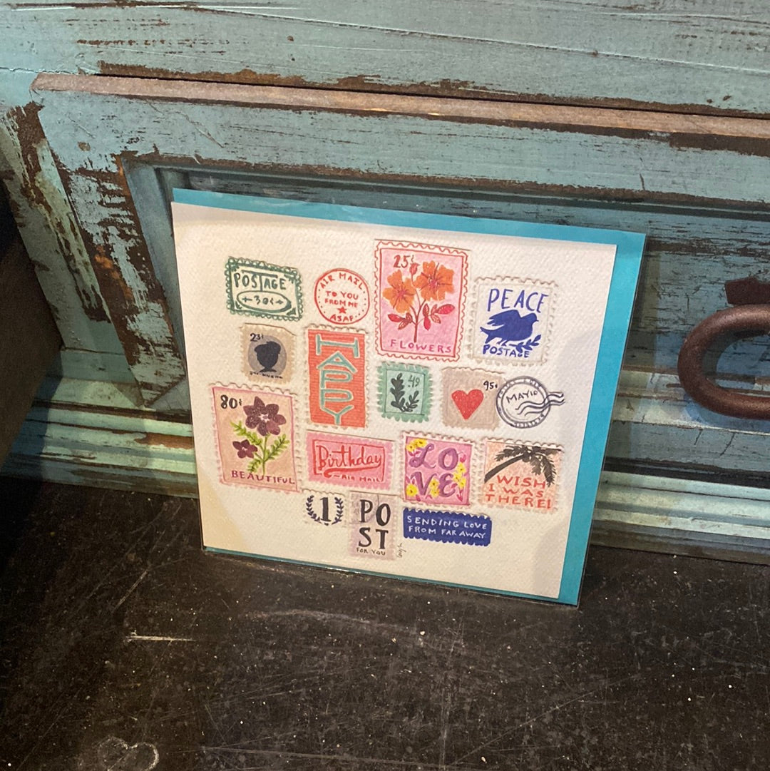 Card featuring collection of vintage and colorful postage stamps.