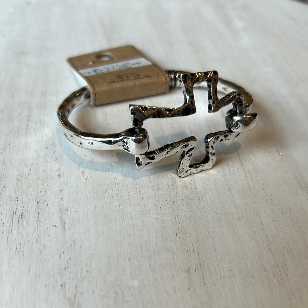 Burnt silver cross bracelet with hinge.