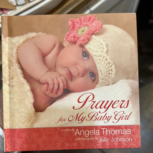 Book with a baby on the cover titling "Prayers for My Baby Girl".