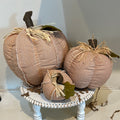 Orange chevron patterned pumpkins in three varying sizes.