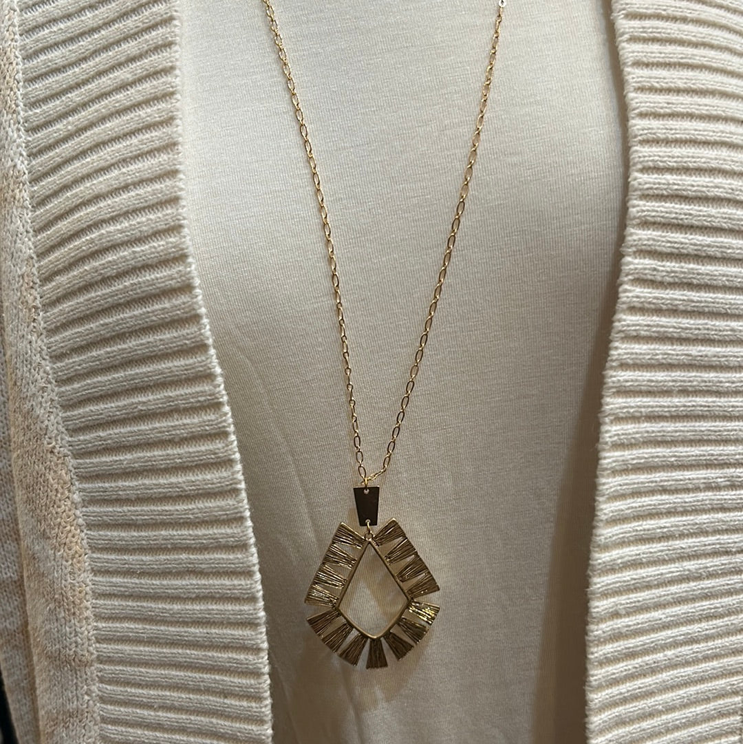 Geometric necklace in gold with golden chain.