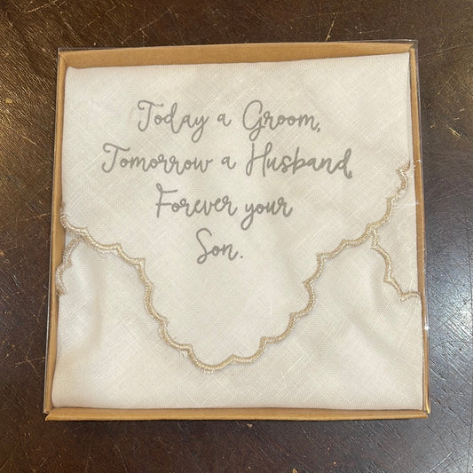 White handkerchief with golden trim featuring "Today a groom, tomorrow a husband, forever your son."