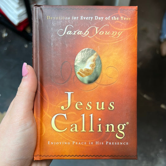 Book with golden cover featuring "Devotions for Every Day of the Year; Sarah Young; Jesus Calling; Enjoying Peace in His Presence"