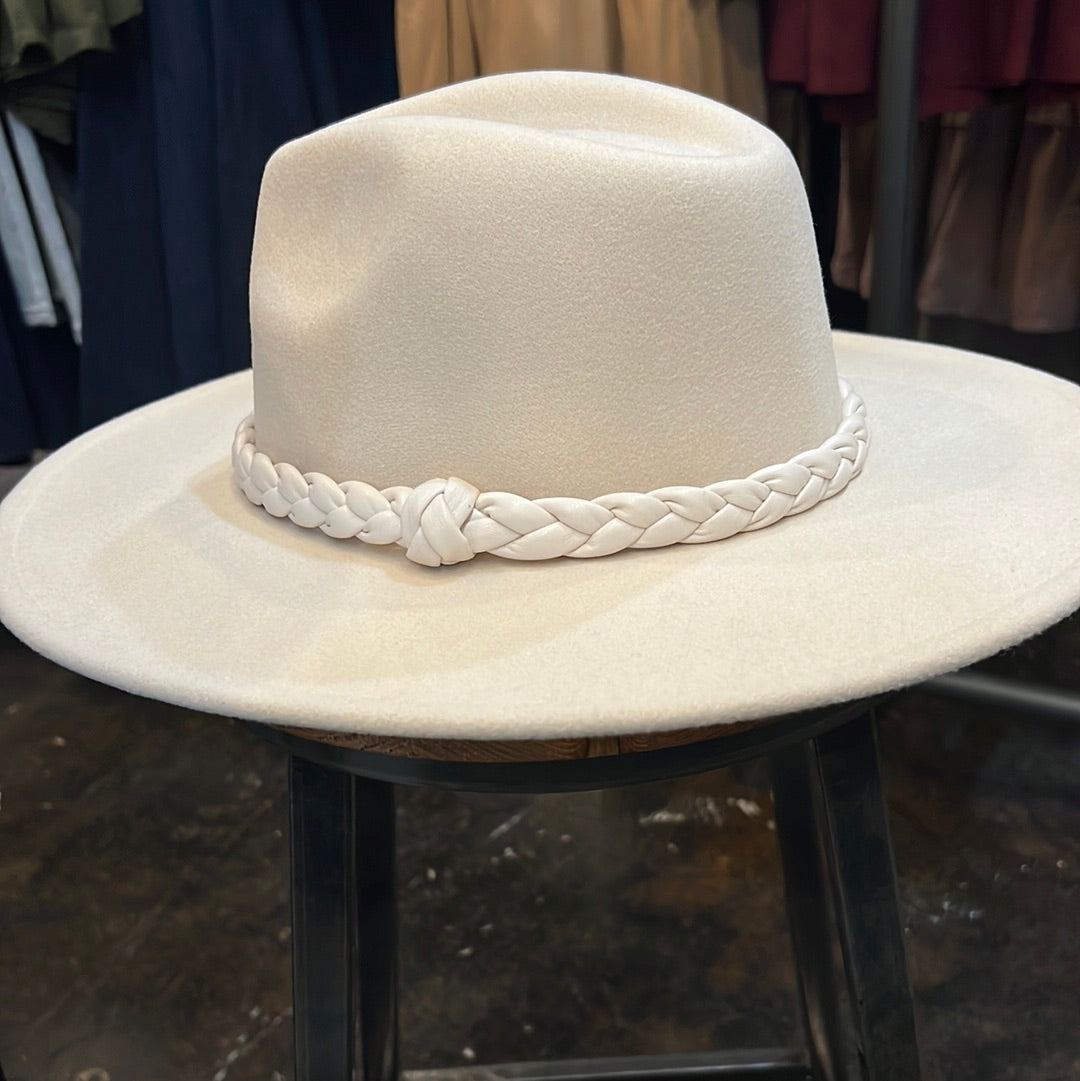 Cream and braided knot wide brim fashion hat.