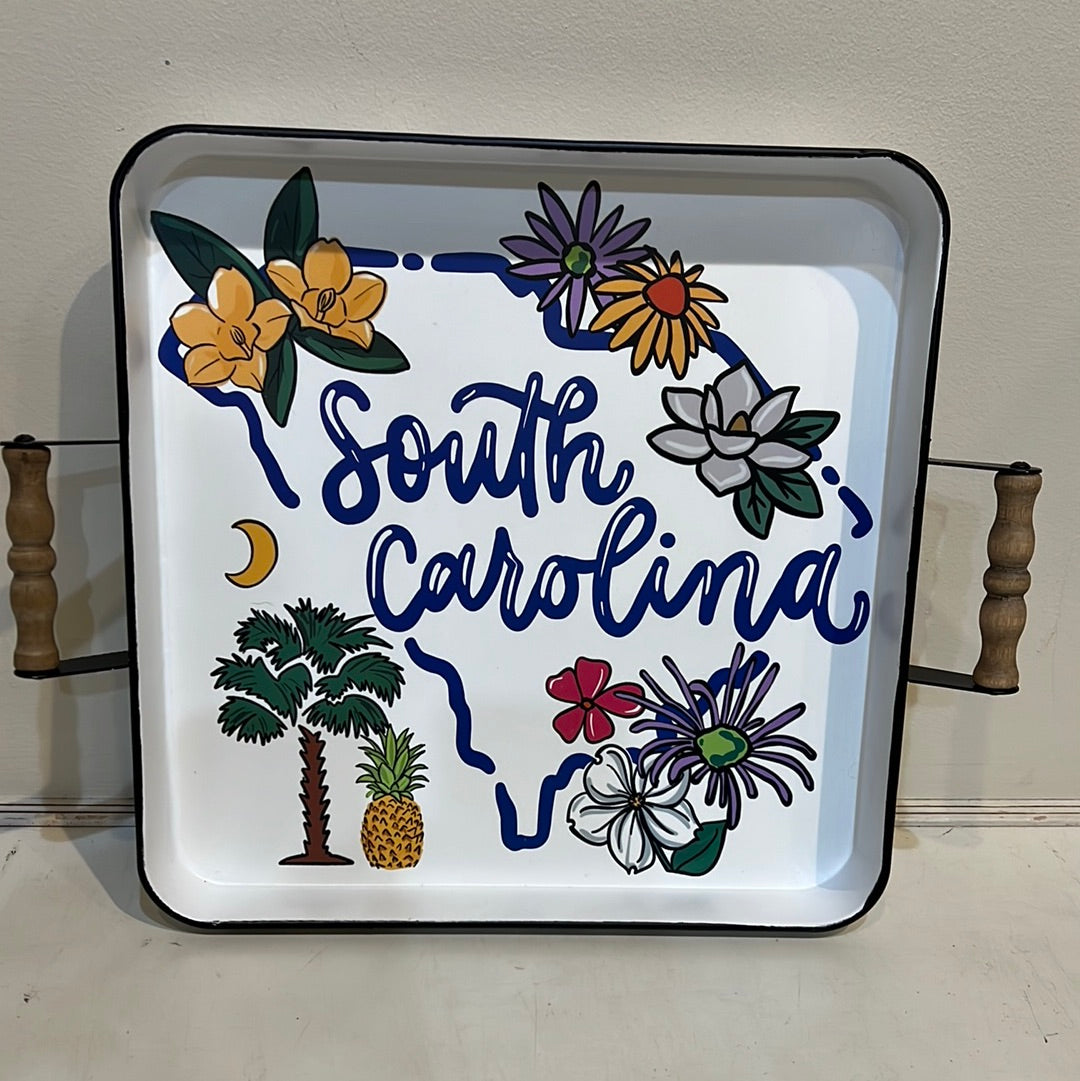 White tray with the outline of South Carolina in blue with depictions of the state featuring the state name.