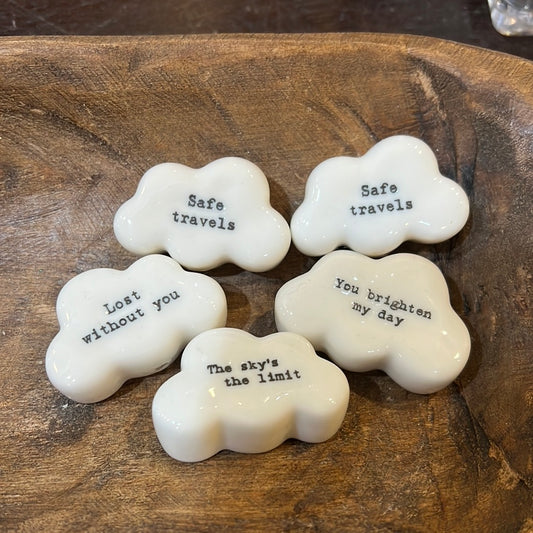 White, ceramic clouds with a variety of encouraging messages such as "Safe travels"; "You brighten my day"; "The sky's the limit"; "Lost without you".